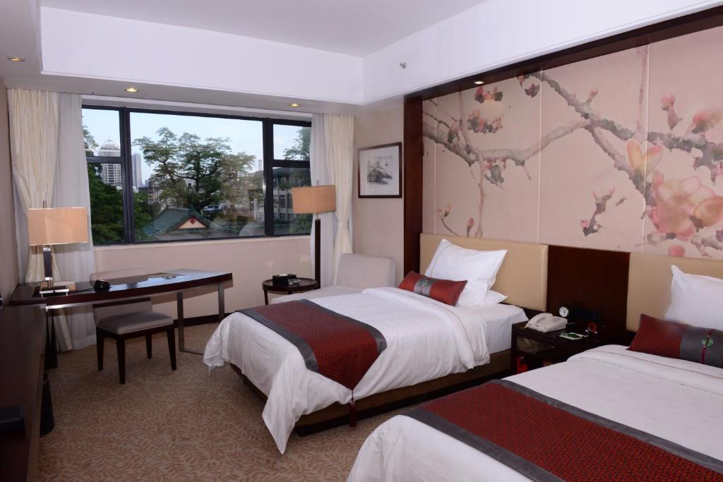 Двухместный (Улучшенный двухместный номер с 2 отдельными кроватями и видом на сад (Байюнь)) отеля Guangdong Yingbin Hotel, Гуанчжоу