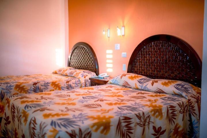 Четырехместный (Четырехместный номер с собственной ванной комнатой) отеля Hotel Los Girasoles, Тепик