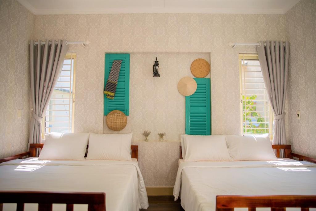 Четырехместный (Четырехместный номер с собственной ванной комнатой) семейного отеля Sampan House, Кантхо