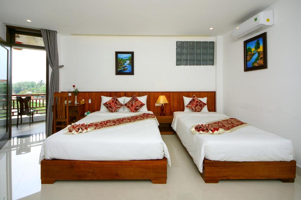Двухместный (Двухместный номер с 2 отдельными кроватями) отеля Threeway Riverside Villa, Хойан