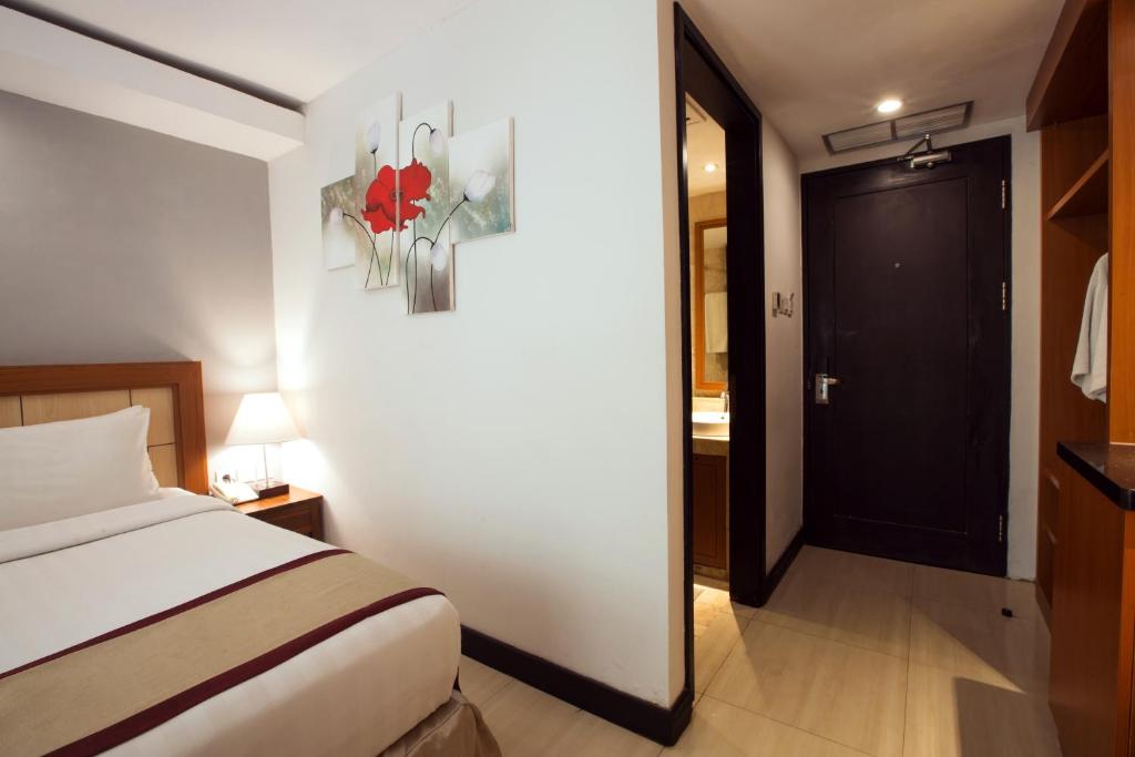 Двухместный (Улучшенный двухместный номер с 1 кроватью) курортного отеля Royal Singosari Kuta, Кута