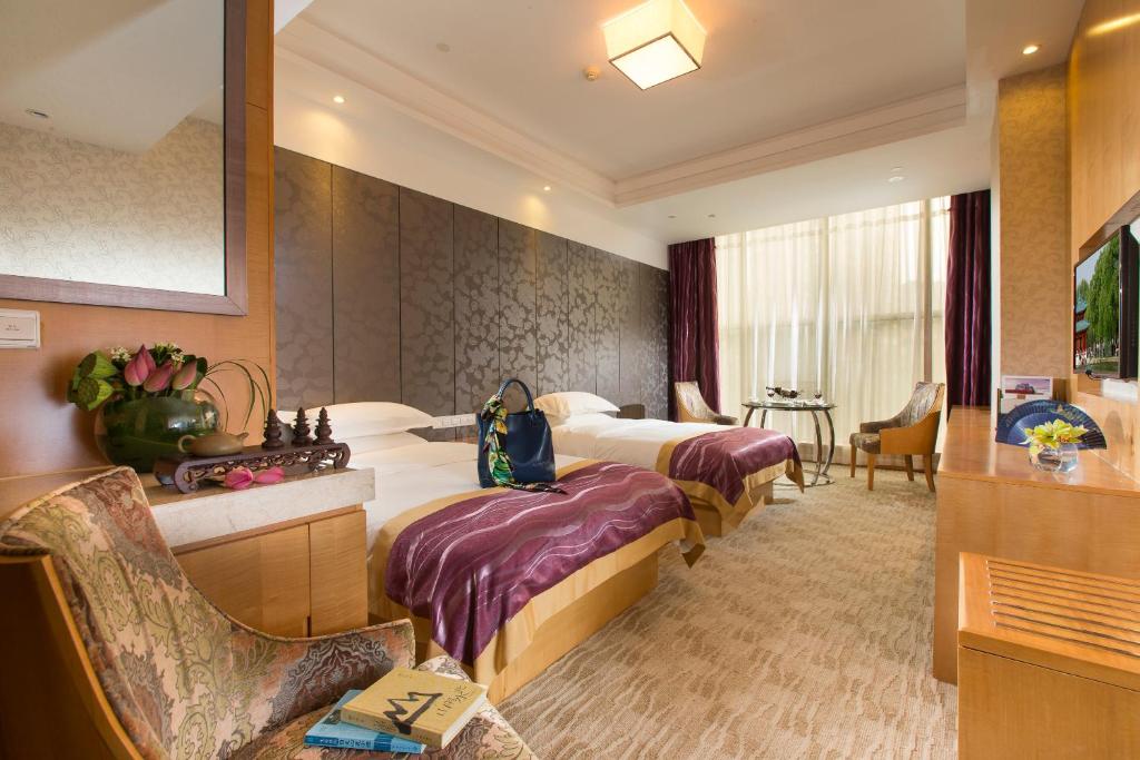 Двухместный (Улучшенный представительский двухместный номер с 2 отдельными кроватями) отеля Huachen International Hotel, Ханчжоу