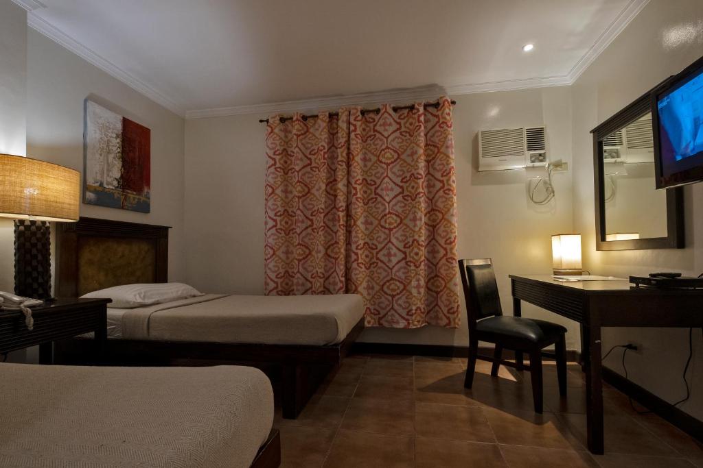 Двухместный (Улучшенный двухместный номер с 2 отдельными кроватями) отеля Palazzo Pensionne, Себу