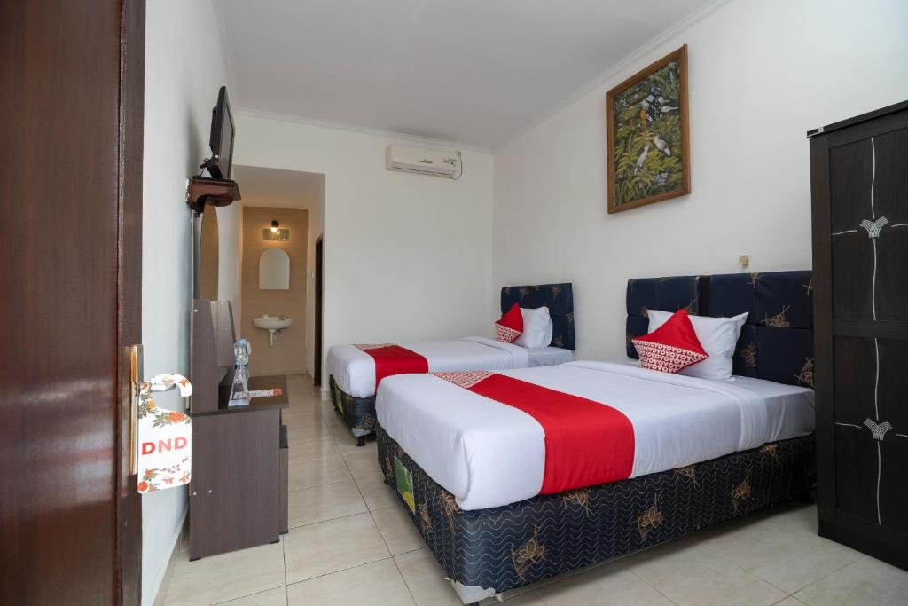 Двухместный (Стандартный двухместный номер с 2 отдельными кроватями) отеля OYO 636 Apartmen Kak Okoh, Чангу