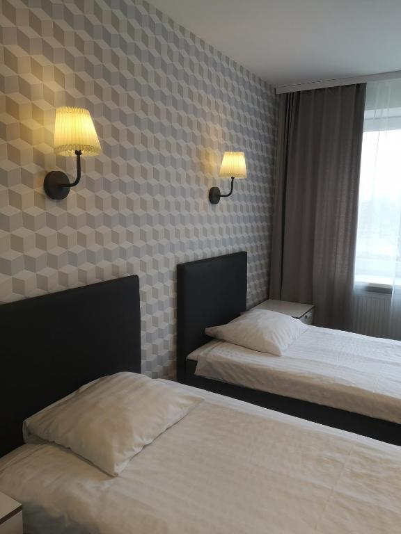 Двухместный (Улучшенный двухместный номер с 2 отдельными кроватями) отеля Dzintarjura, Вентспилс