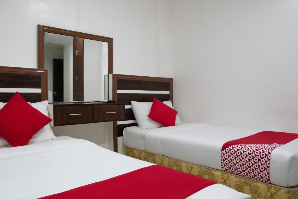 Двухместный (Стандартный двухместный номер с 2 отдельными кроватями) отеля OYO 165 Circle-B Apartelle & Suites, Давао