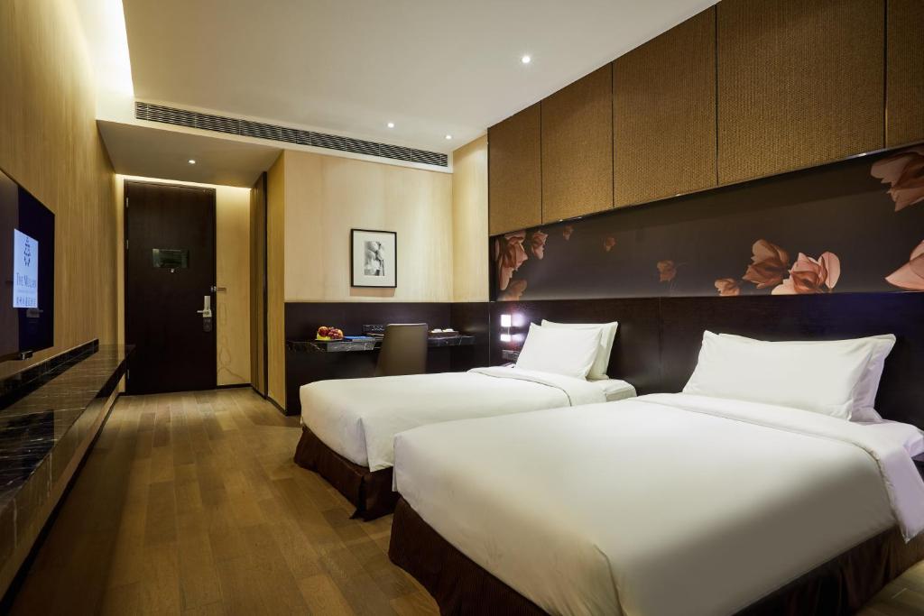 Двухместный (Двухместный номер Делюкс с 2 отдельными кроватями (без окна)) отеля The Mulian Hotel, Гуанчжоу