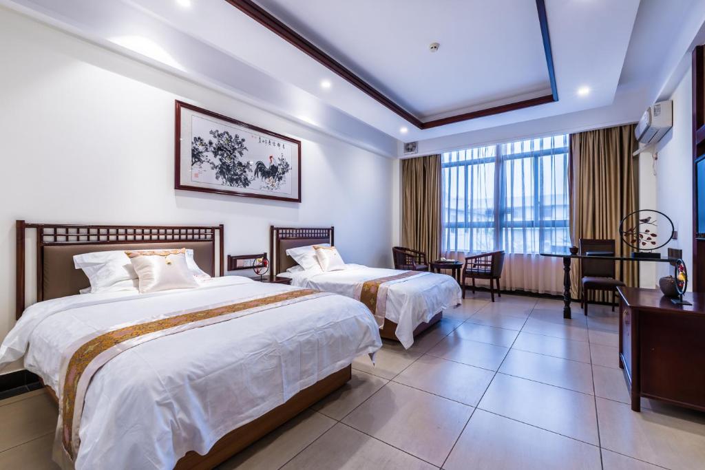 Двухместный (Двухместный номер Делюкс с 2 отдельными кроватями) отеля Hainan Jingshan Hotel, Хайкоу