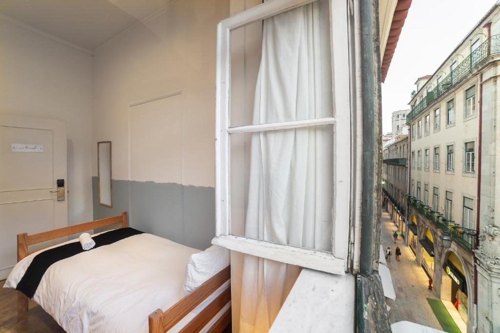 Двухместный (Стандартный двухместный номер с 2 отдельными кроватями) хостела Rossio Hostel, Лиссабон