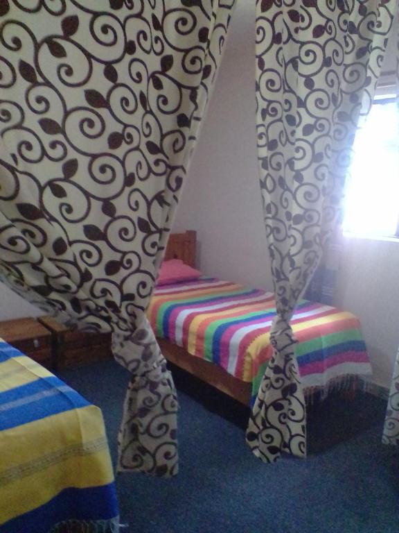 Номер (Односпальная кровать в общем номере с 6 кроватями) хостела Hostel Mirador, Сан-Кристобаль-де-лас-Касас