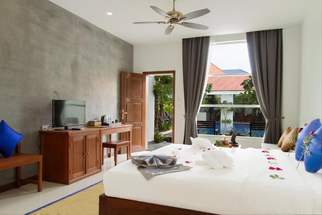 Двухместный (Двухместный номер с 1 кроватью, вид на бассейн - Бесплатный трансфер из аэропорта) виллы Angkor Mango Tree Boutique Hotel, Сием Рип
