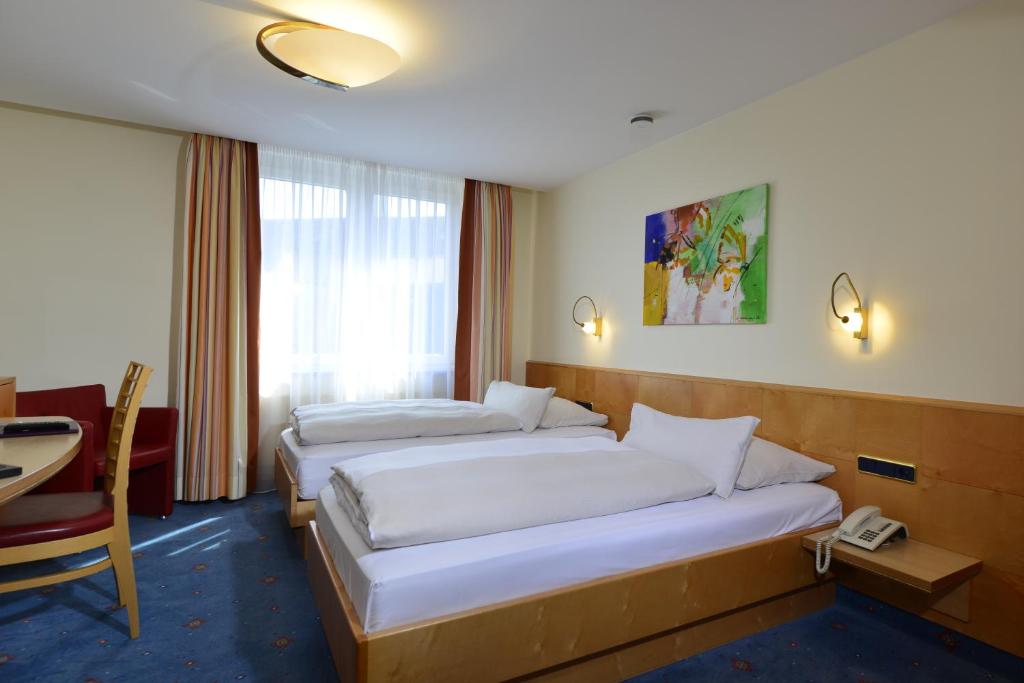 Двухместный (Стандартный двухместный номер с 2 отдельными кроватями) отеля Hotel Torbräu, Мюнхен