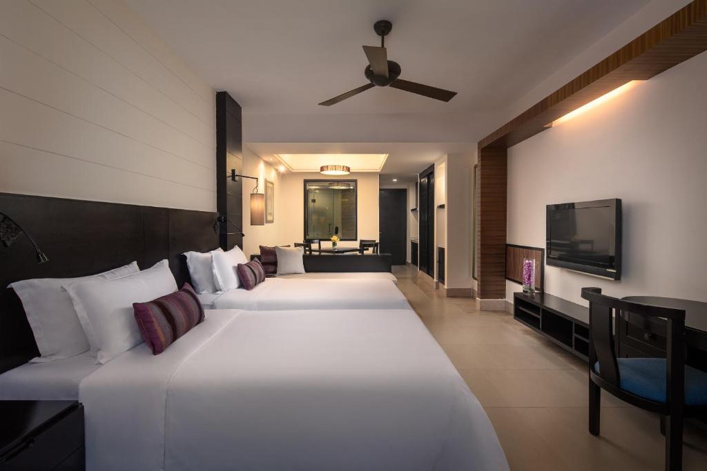 Двухместный (Улучшенный двухместный номер с 2 отдельными кроватями и видом на сад) отеля Lihe Hotel, Санья