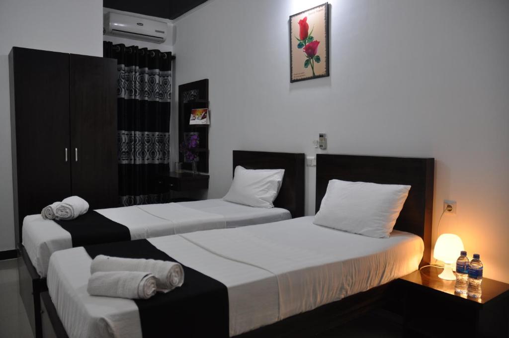 Двухместный (Улучшенный двухместный номер с 2 отдельными кроватями) отеля Hotel Agape, Маннар