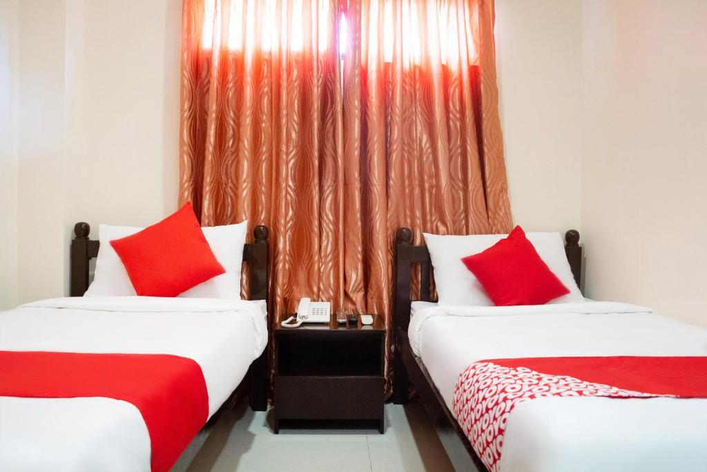 Двухместный (Стандартный двухместный номер с 2 отдельными кроватями) отеля OYO 153 Monclaire Suites, Давао