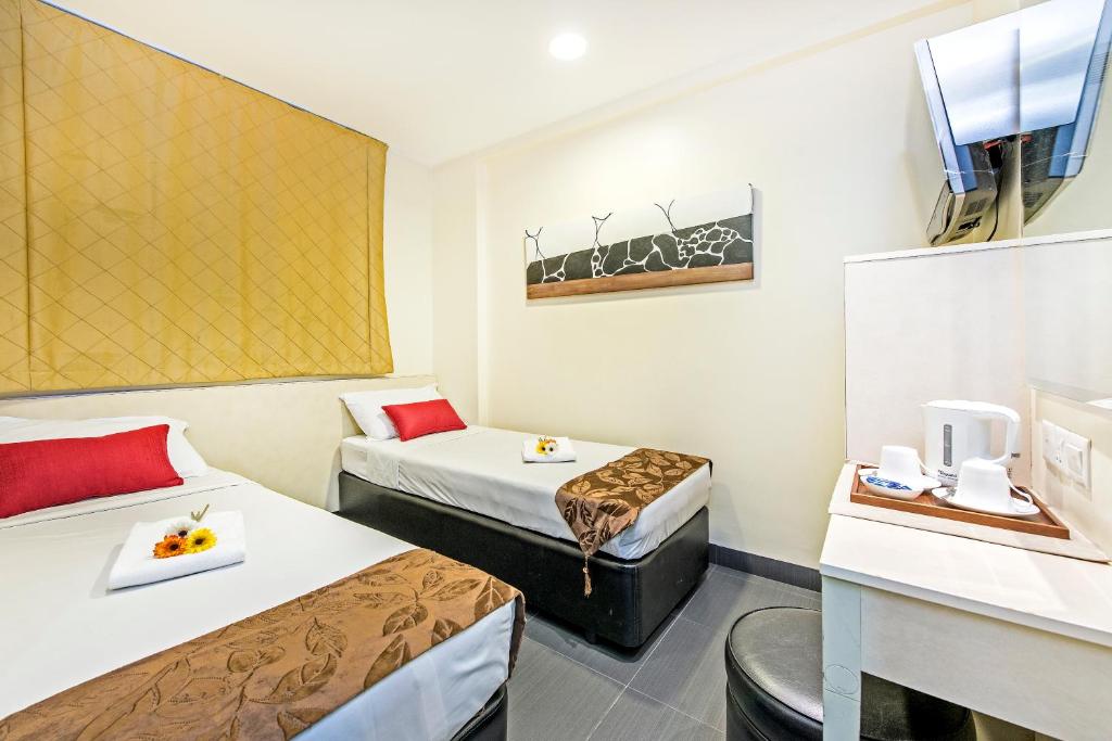 Двухместный (Стандартный двухместный номер с 2 отдельными кроватями) отеля Hotel 81 Selegie, Сингапур (город)