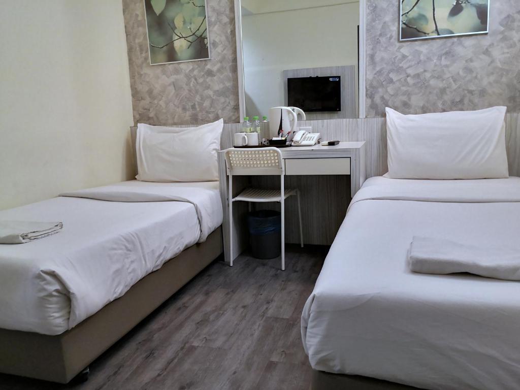 Двухместный (Улучшенный двухместный номер с 2 отдельными кроватями) отеля Hotel Westree KL Sentral, Куала-Лумпур
