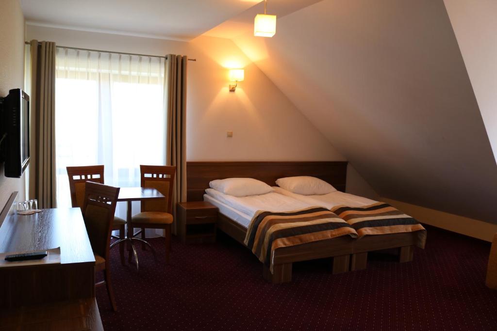 Трехместный (Трехместный номер) отеля Hotel DYMINY, Кельце