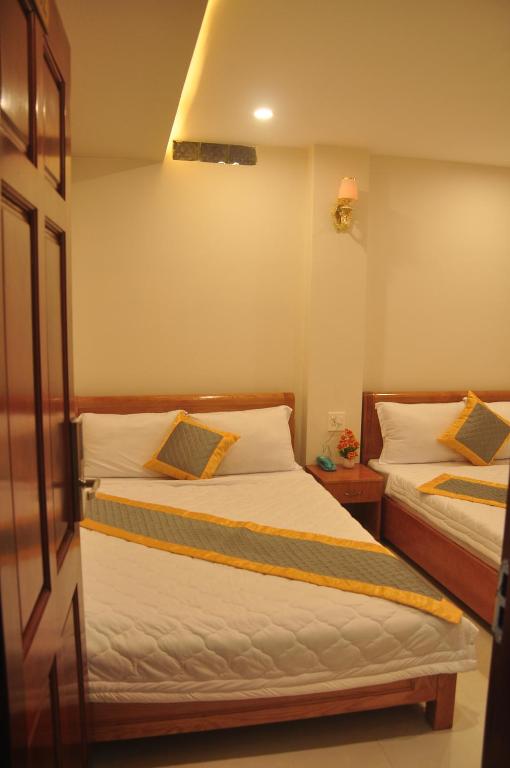 Двухместный (Улучшенный двухместный номер с 2 отдельными кроватями) отеля Nhân Anh Hotel, Куинён