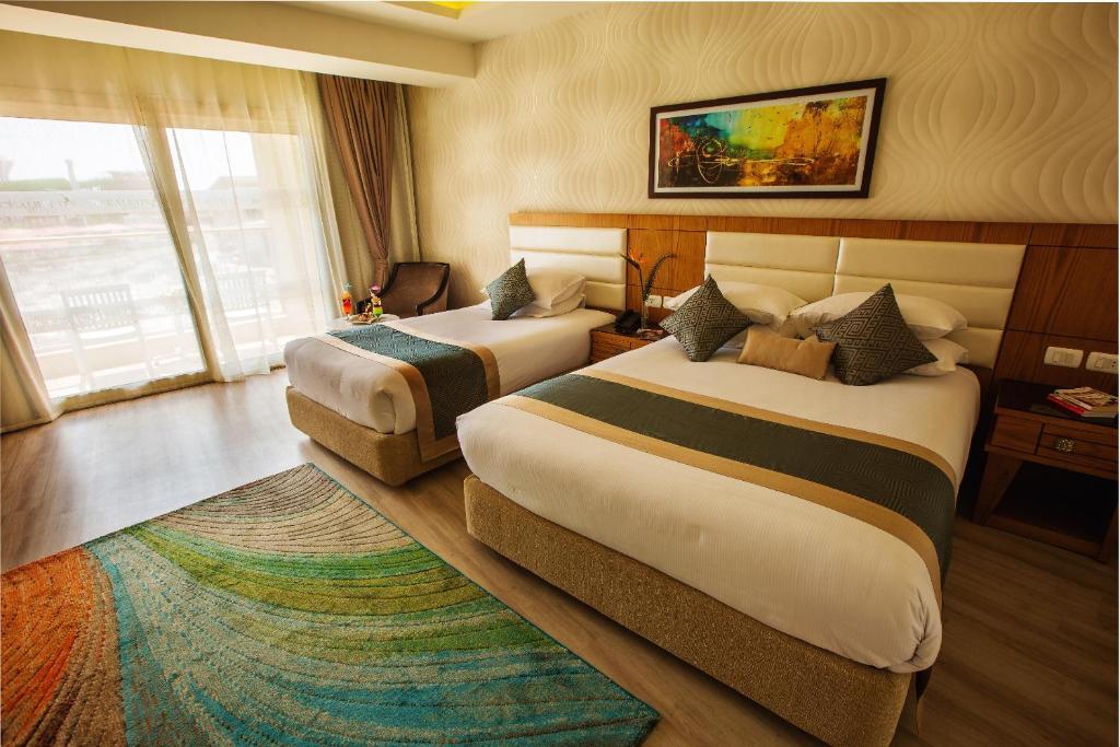 Двухместный (Улучшенный двухместный номер с 1 кроватью или 2 отдельными кроватями) курортного отеля Aqua Blu Sharm El Sheikh, Шарм-эль-Шейх