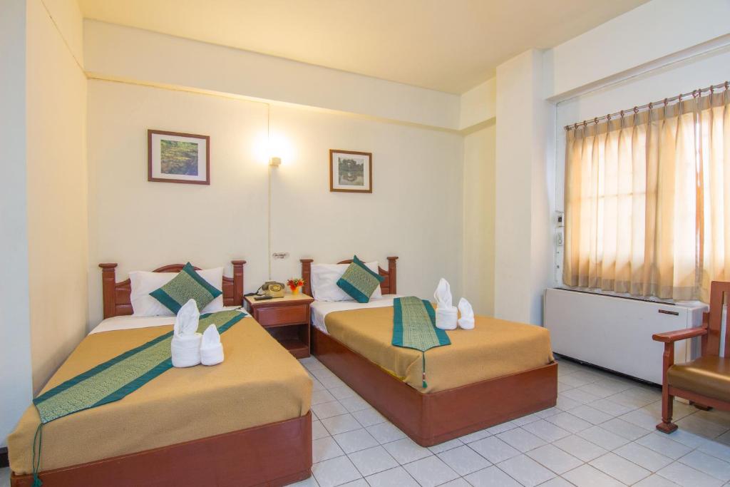 Двухместный (Улучшенный двухместный номер с 2 отдельными кроватями) отеля Khelang Nakorn Hotel, Лампанг
