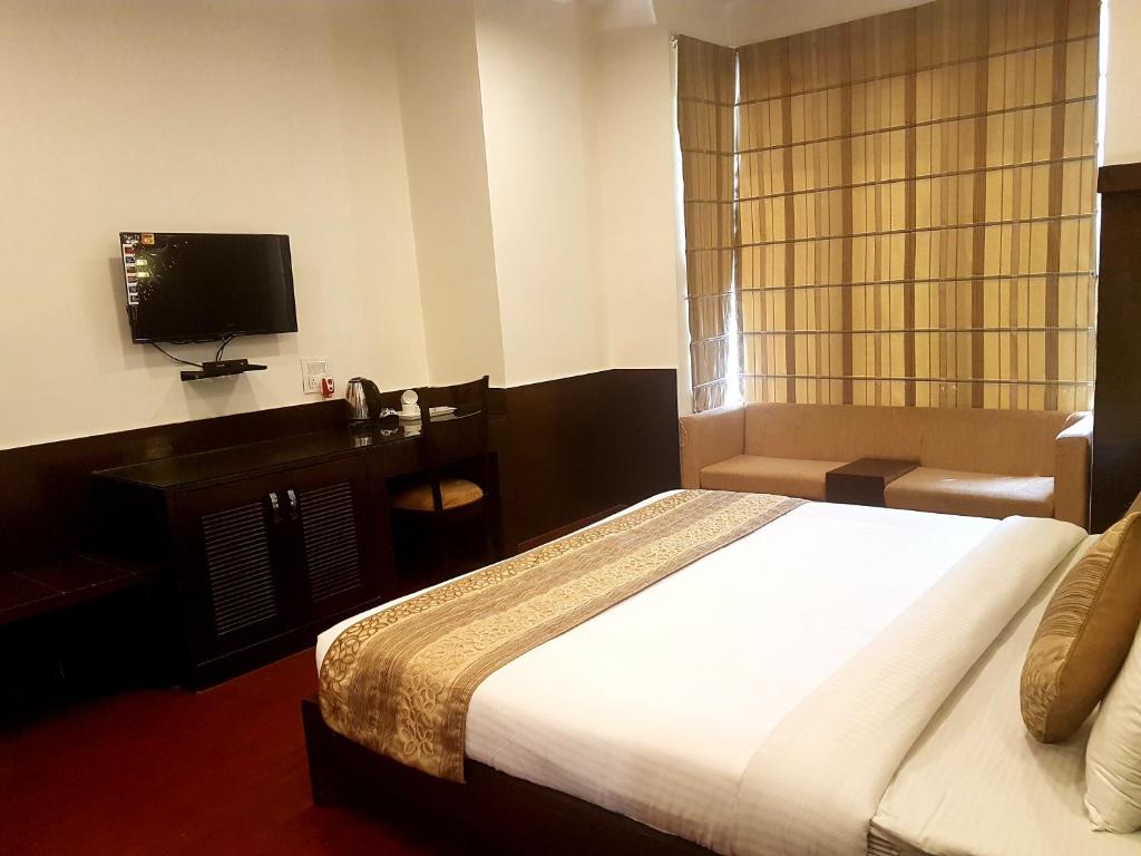 Двухместный (Двухместный номер Делюкс с 1 кроватью или 2 отдельными кроватями) отеля Hari's Court, M.G. Road Metro, Гургаон