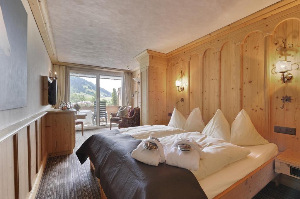 Двухместный (Классический двухместный номер с 2 отдельными кроватями - Ried) отеля ERMITAGE Wellness- & Spa-Hotel, Гштад