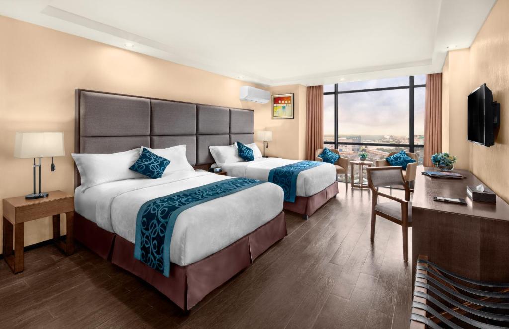 Двухместный (Двухместный номер Делюкс с 2 отдельными кроватями) отеля Golden Phoenix Hotel - Manila, Манила