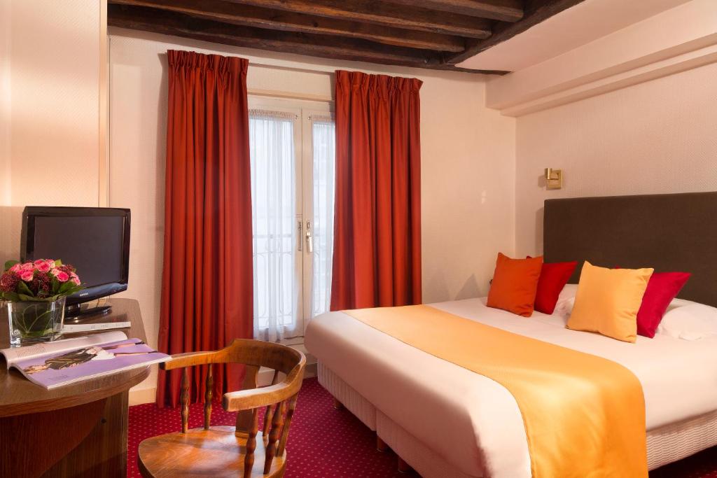 Двухместный (Улучшенный двухместный номер с 1 кроватью) отеля Hôtel Saint Roch, Париж