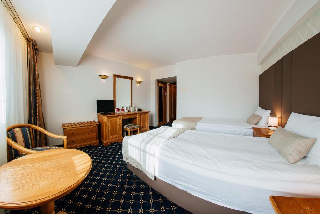 Двухместный (Стандартный двухместный номер с 1 кроватью или 2 отдельными кроватями) отеля Best Western Bucovina Club de Munte, Гура-Гуморулуй