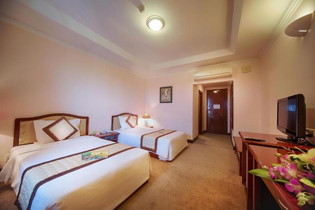Двухместный (Улучшенный двухместный номер с 2 отдельными кроватями) отеля Muong Thanh Grand Phuong Dong, Винь