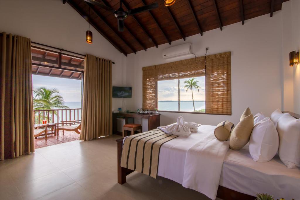 Двухместный (Двухместный номер Делюкс с 1 кроватью или 2 отдельными кроватями и видом на море) отеля Ananya Beach Resort, Тангалла