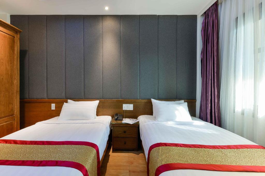 Двухместный (Двухместный номер Делюкс с 2 отдельными кроватями) отеля Dragon Palace Hotel, Хошимин