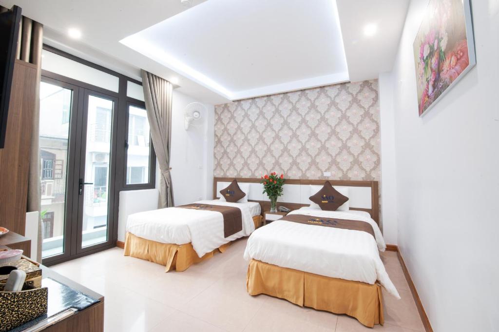 Двухместный (Двухместный номер Делюкс с 2 отдельными кроватями) отеля Khách Sạn Sao, Ханой
