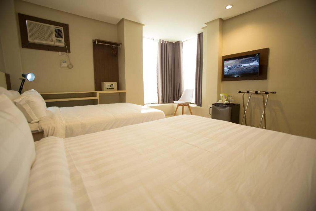 Двухместный (Двухместный номер Делюкс с 1 кроватью или 2 отдельными кроватями) отеля The Lanang Suites, Давао