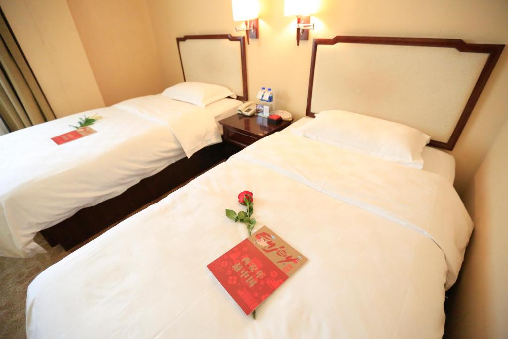 Двухместный (Уютный двухместный номер с 2 отдельными кроватями) отеля Bell Tower Hotel Xi'an, Сиань