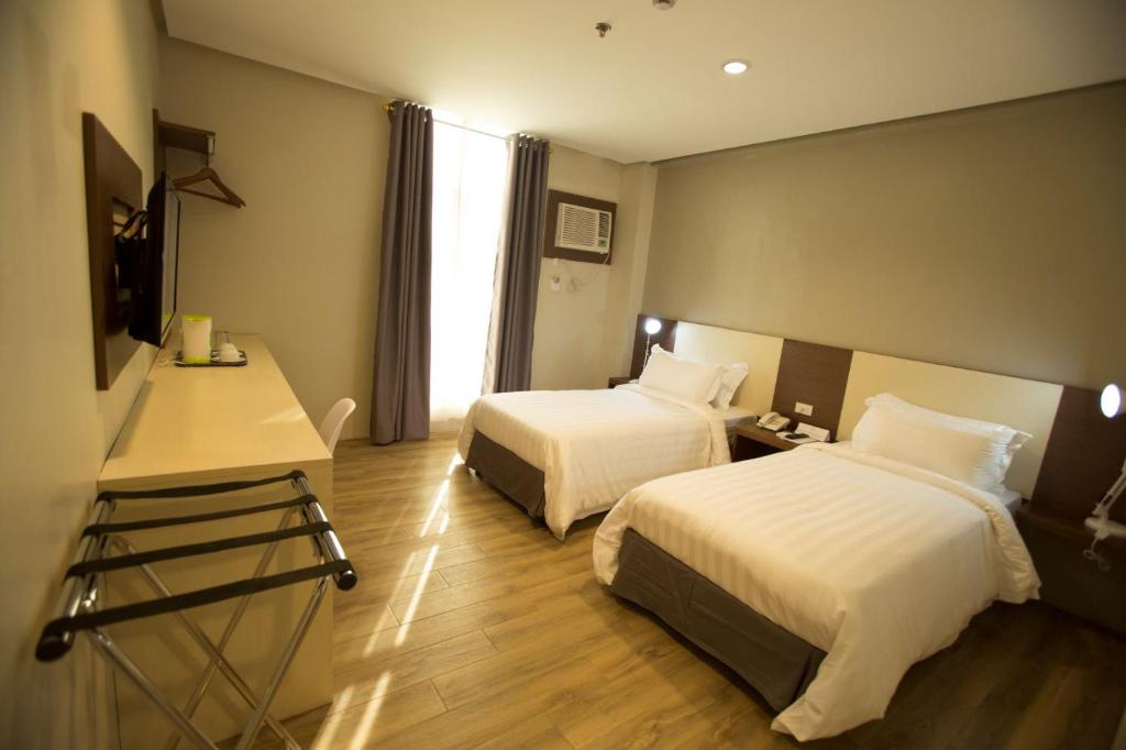 Двухместный (Стандартный двухместный номер с 1 кроватью или 2 отдельными кроватями) отеля The Lanang Suites, Давао