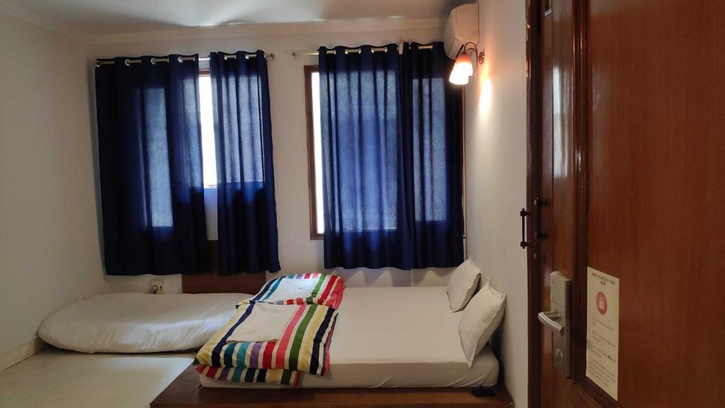 Двухместный (Стандартный двухместный номер с 1 кроватью и общей ванной комнатой) хостела The Madpackers Hostel, Нью-Дели