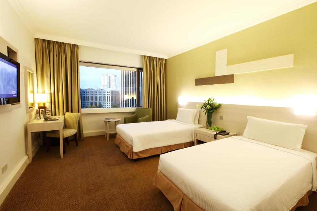 Двухместный (Двухместный номер Делюкс с 2 отдельными кроватями) отеля Corus Hotel Kuala Lumpur, Куала-Лумпур