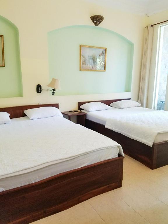 Двухместный (Двухместный номер с 1 кроватью или 2 отдельными кроватями и балконом) отеля Caroline Hotel, Хошимин