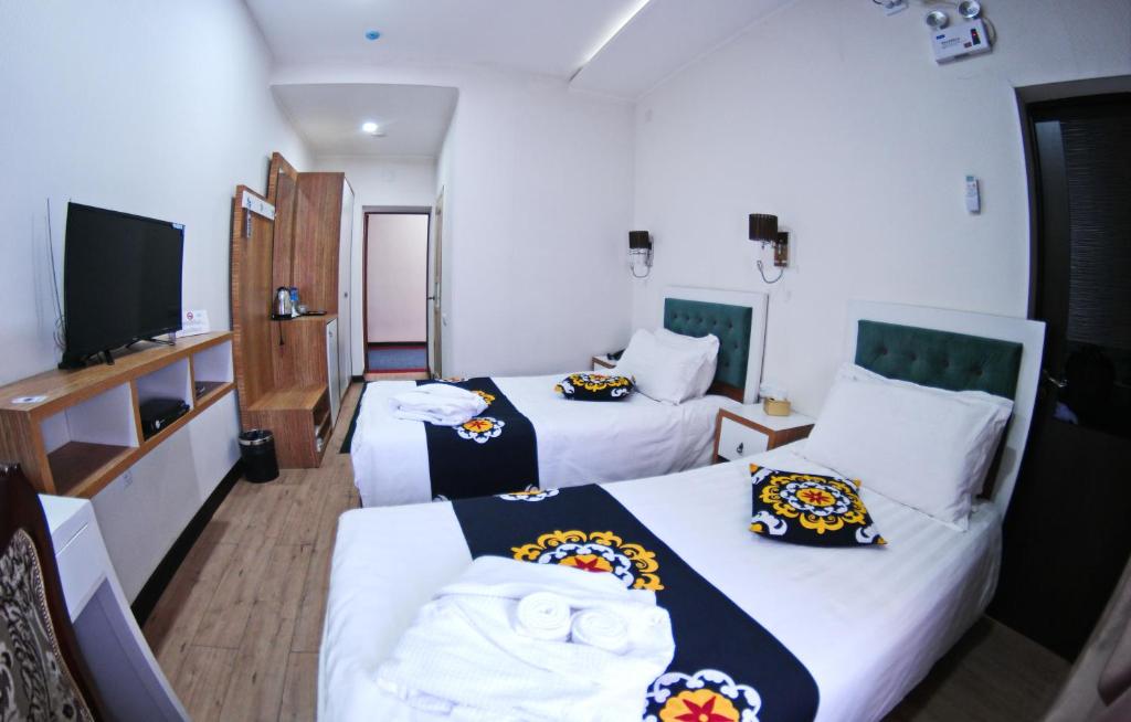 Двухместный (Двухместный номер с 2 отдельными кроватями) гостевого дома Rohat Hotel, Душанбе