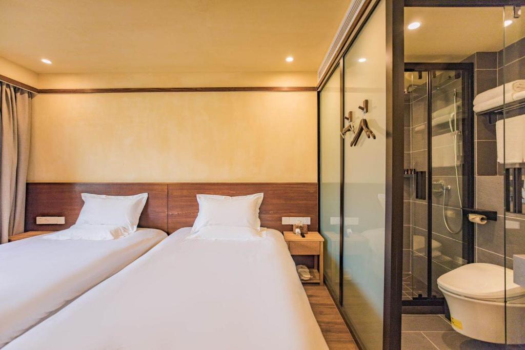 Двухместный (Стандартный двухместный номер с 2 отдельными кроватями) семейного отеля Van Wind Inn, Ханчжоу