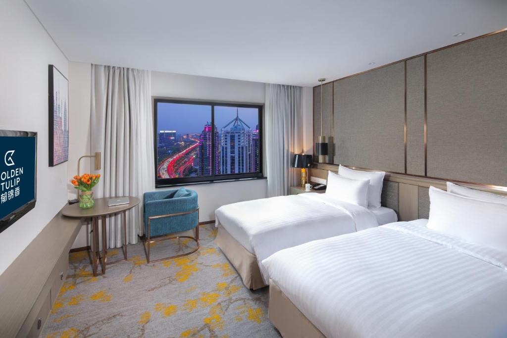 Двухместный (Двухместный номер Делюкс с 2 отдельными кроватями) отеля Jin Jiang Rainbow Hotel, Шанхай