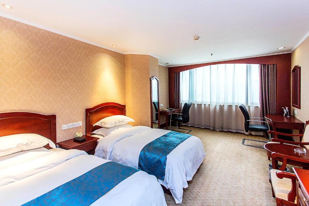 Двухместный (Двухместный номер с 2 отдельными кроватями и видом на озеро) отеля Golden Port Hotel Ningbo, Нинбо