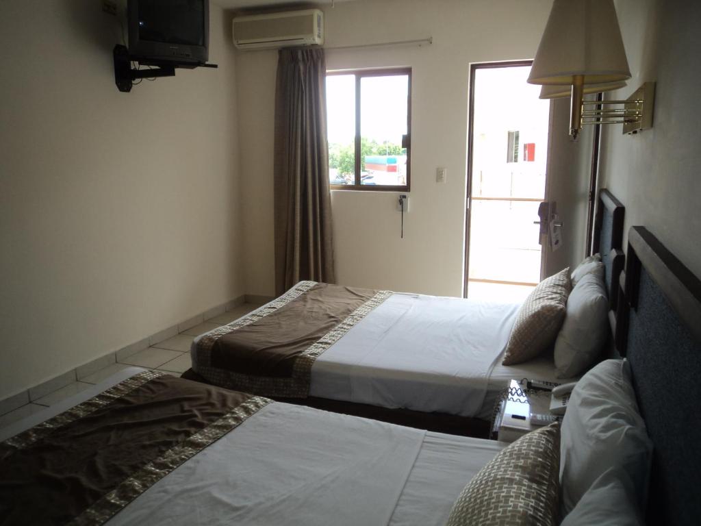 Четырехместный (Четырехместный номер) отеля Hotel Hacienda Nainari, Сьюдад-Обрегон