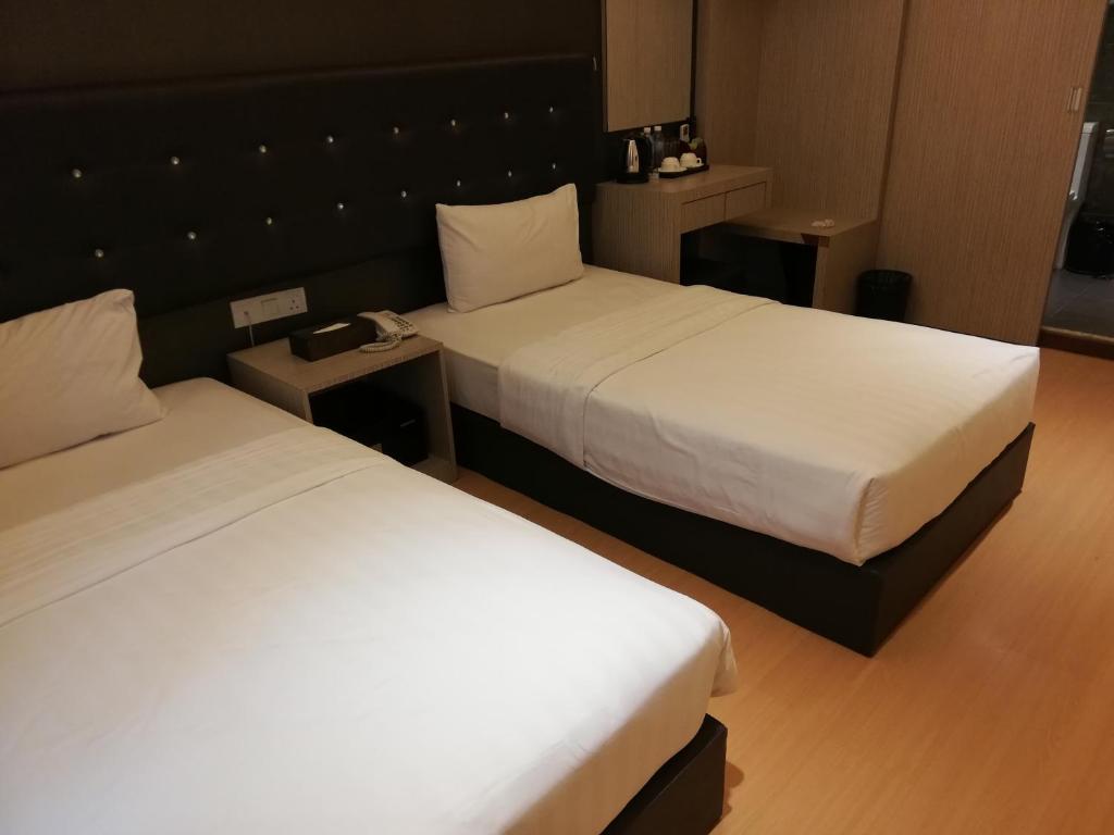 Двухместный (Стандартный двухместный номер с 2 отдельными кроватями) отеля Ease Hotel, Кота-Кинабалу