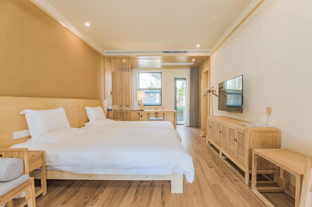 Двухместный (Стандартный номер с 2 односпальными кроватями и диваном) семейного отеля Van Wind Inn, Ханчжоу