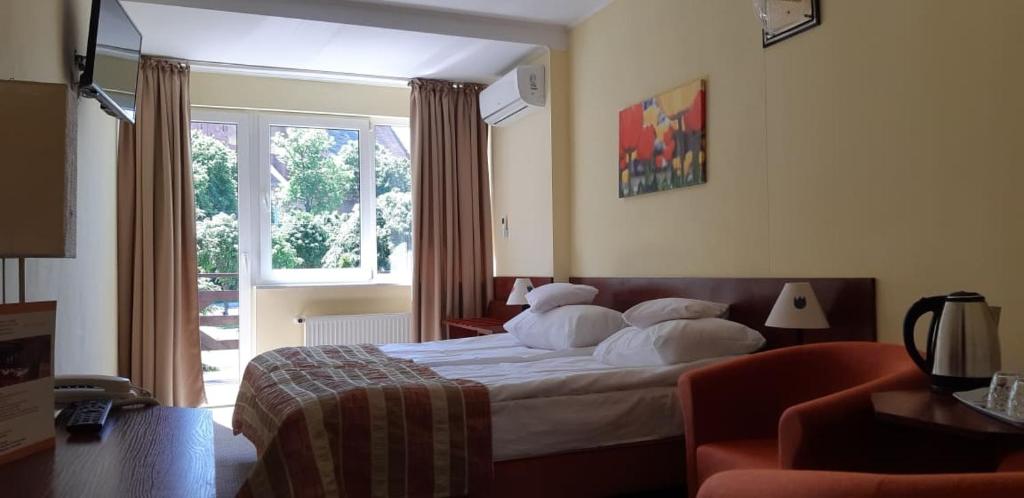 Двухместный (Улучшенный двухместный номер с 1 кроватью или 2 отдельными кроватями и террасой) отеля Hotel Kopernik, Фромборк