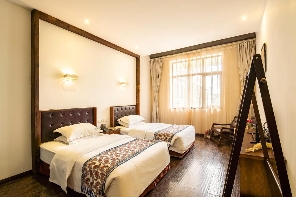 Двухместный (Стандартный двухместный номер с 2 отдельными кроватями) отеля Qintai beautiful Inn, Чэнду