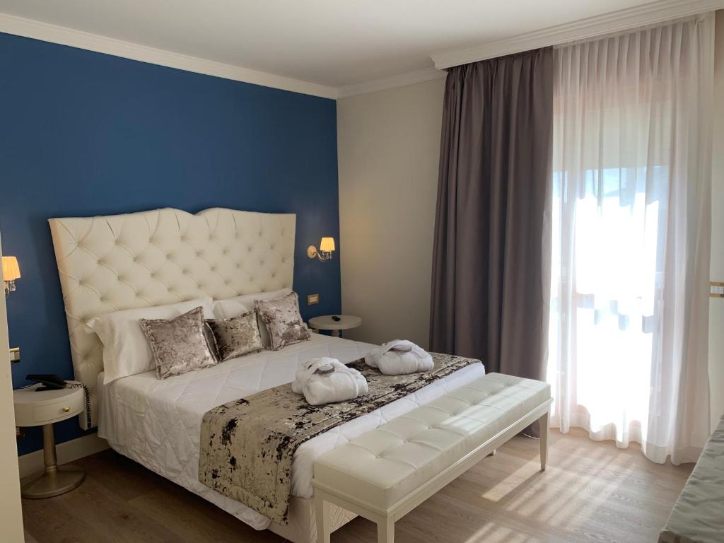 Двухместный (Двухместный номер Делюкс с 1 кроватью или 2 отдельными кроватями и балконом) отеля Hotel Ca' D'Oro, Бибионе